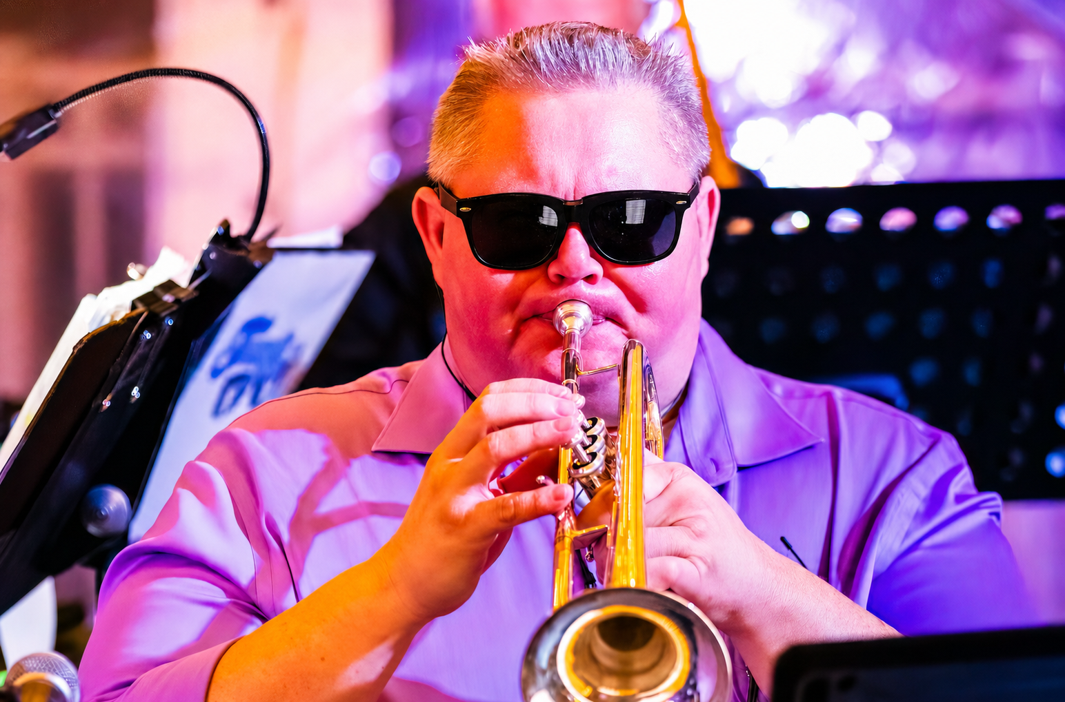 Transit Brothers horn performer directing trumpet toward the audience
